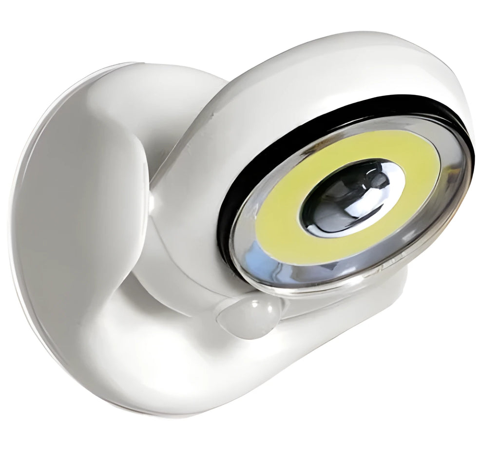 White Atomic Angel induction lamp on surface showing compact 13.3 cm height and ABS plastic construction.