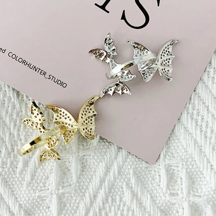 Turnable anxiety ring with bead in rose gold finish, copper construction, adjustable opening, butterfly motif