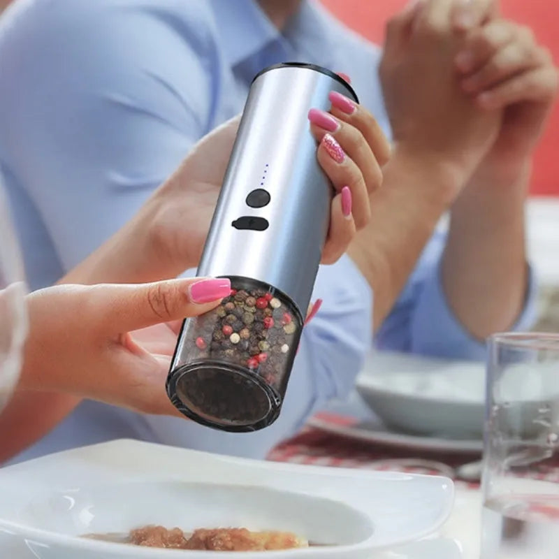 Rechargeable electric pepper and salt grinder with LED light and stainless steel top on white background