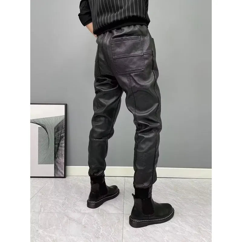 Black PU leather motorcycle takeaway pants with cuffs, tapered leg, and mid-rise waist, on a model