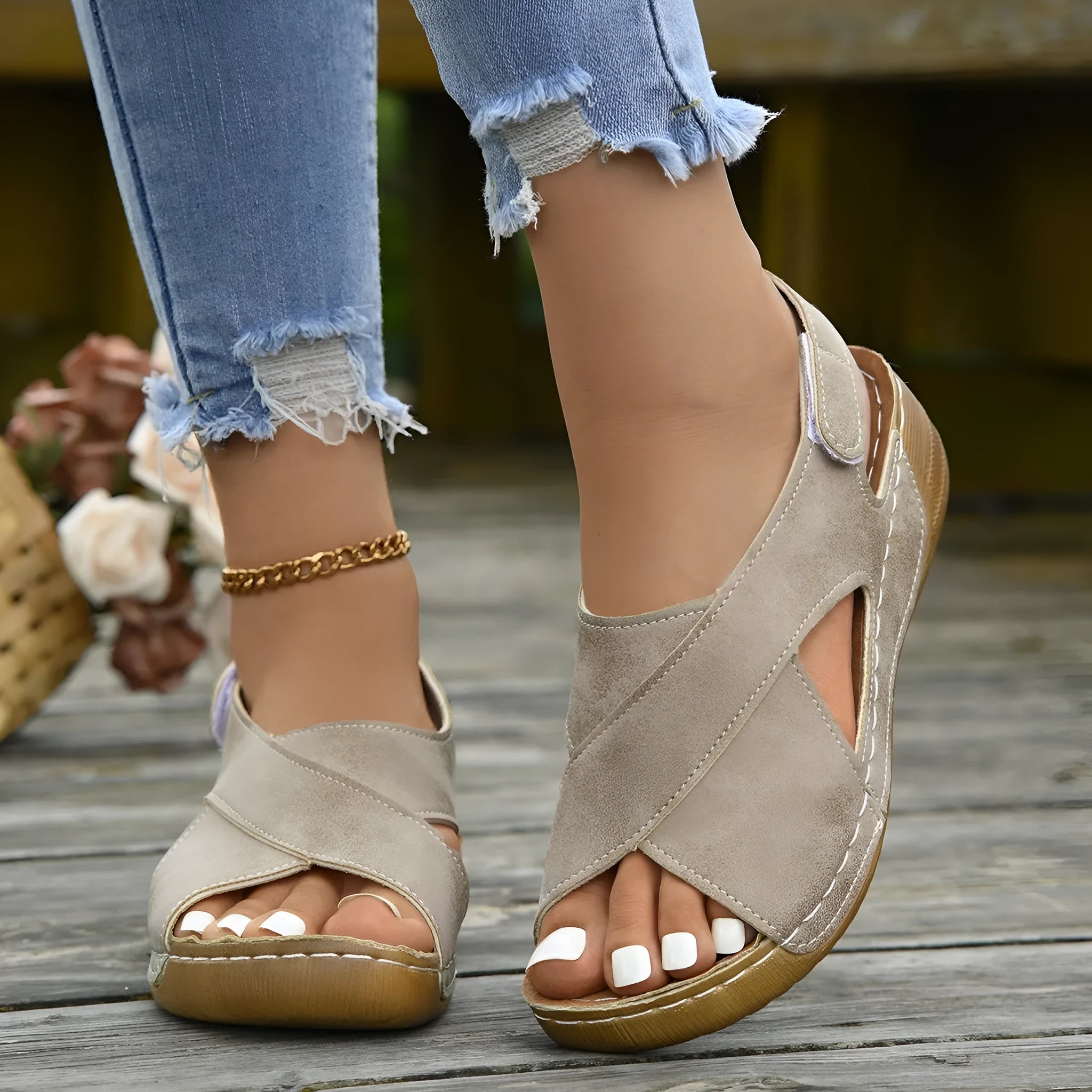Women's brown platform Roman sandals with Velcro strap closure and open toe design