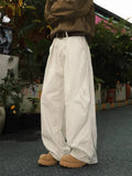 Men's straight-leg trousers with pleated front and elastic waistband in stripe pattern