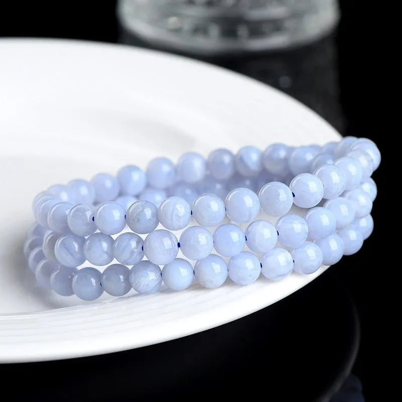Blue agate multi-circle pattern bead bracelet with original design on a wrist