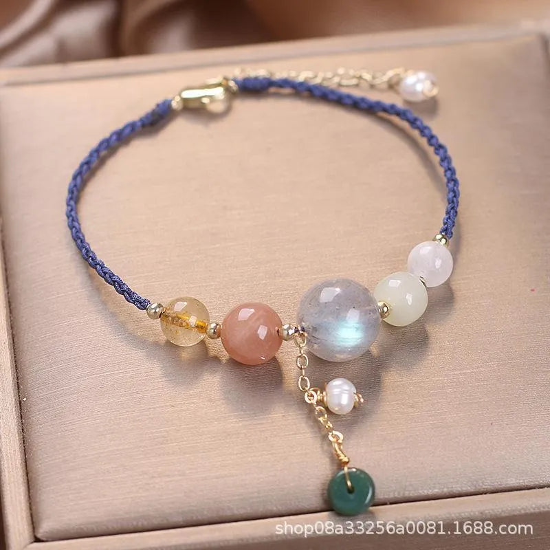 Hand-woven peace buckle bracelet with crystal and sequin details in red, green, and blue colour options for women