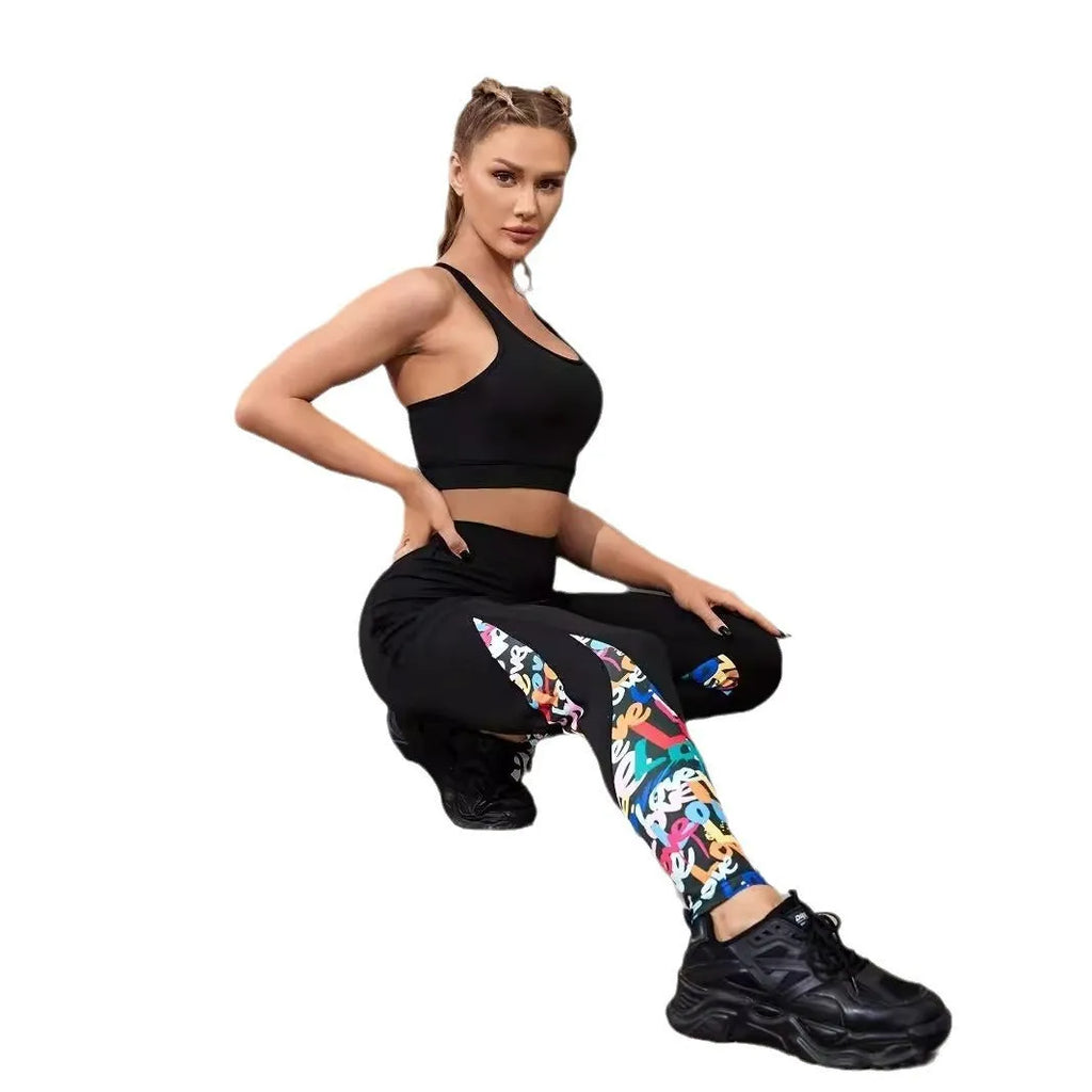 Woman wearing black ribbon letters colour contrast patchwork high waist yoga leggings with pocket