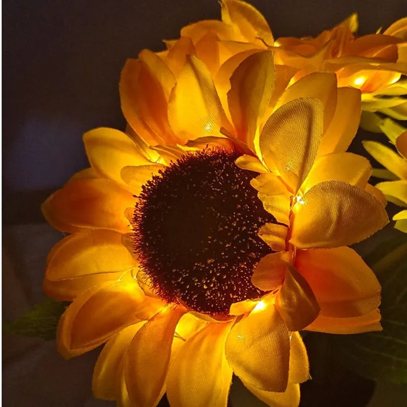 Rechargeable sunflower LED simulation night light with warm glow on a table