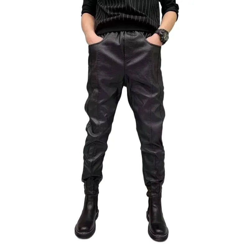 Black PU leather motorcycle takeaway pants with cuffs, tapered leg, and mid-rise waist, on a model