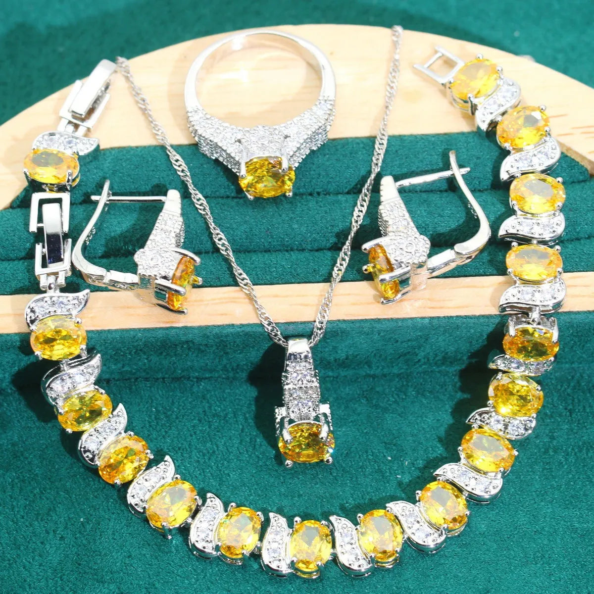 Bridal zircon jewellery four-piece set showing necklace, bracelet, earrings, and ring with water wave chain