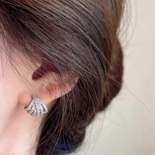Platinum-coloured geometric line design earrings with zircon construction