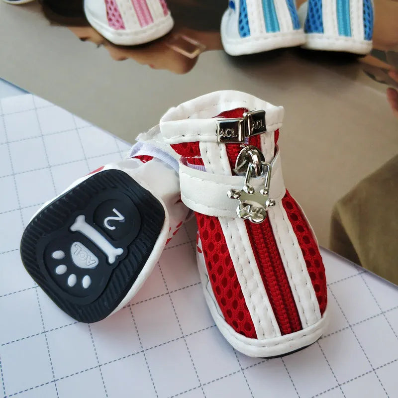 Blue zipper dog shoes for small pets showing non-slip sole and fleece lining.