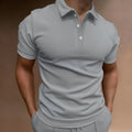Men's grey loose-fit button t-shirt with short sleeves, made from cotton blend fabric.
