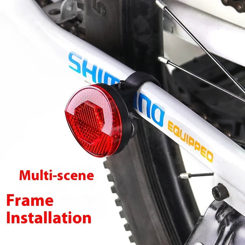 Red plastic positioning anti-theft taillight bracket attached to bicycle seat post