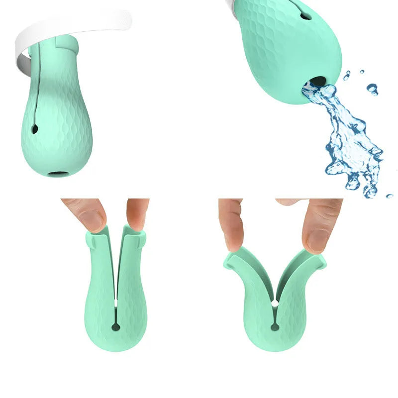 Four green silicone cat paw covers designed to prevent scratching and assist with pet handling