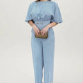 Blue polyester casual suit set with long sleeve top and trousers on a hanger