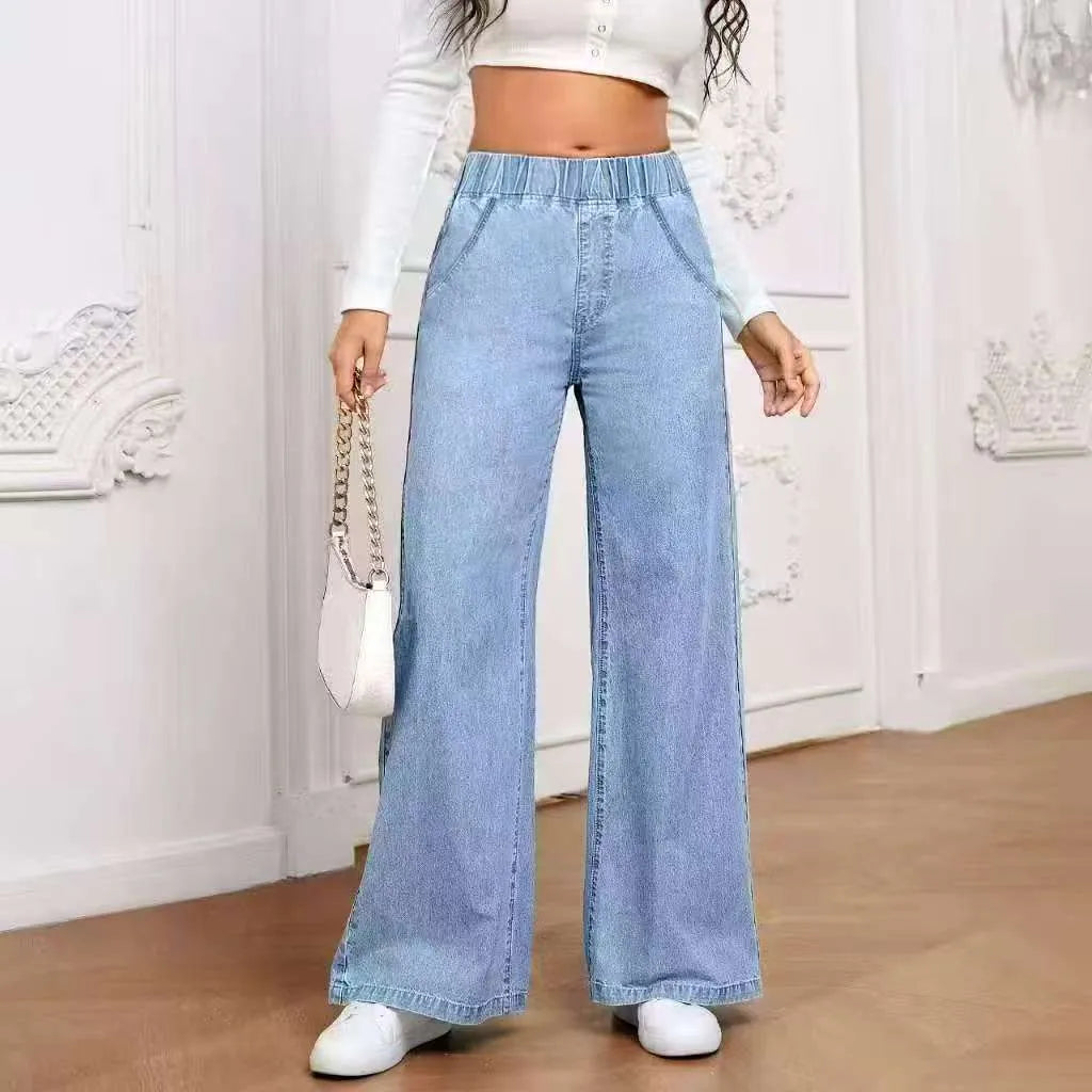 Light blue washed wide-leg denim jeans with straight cut and mid-rise waist on hanger
