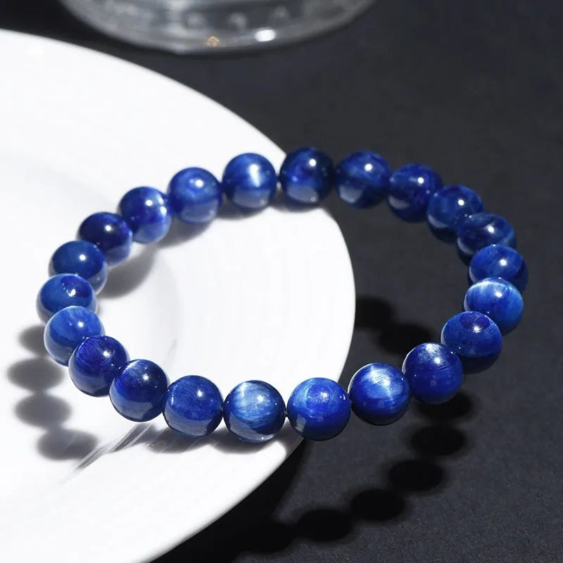 Blue crystal bracelet with geometric shape and Ruyi design element on wrist