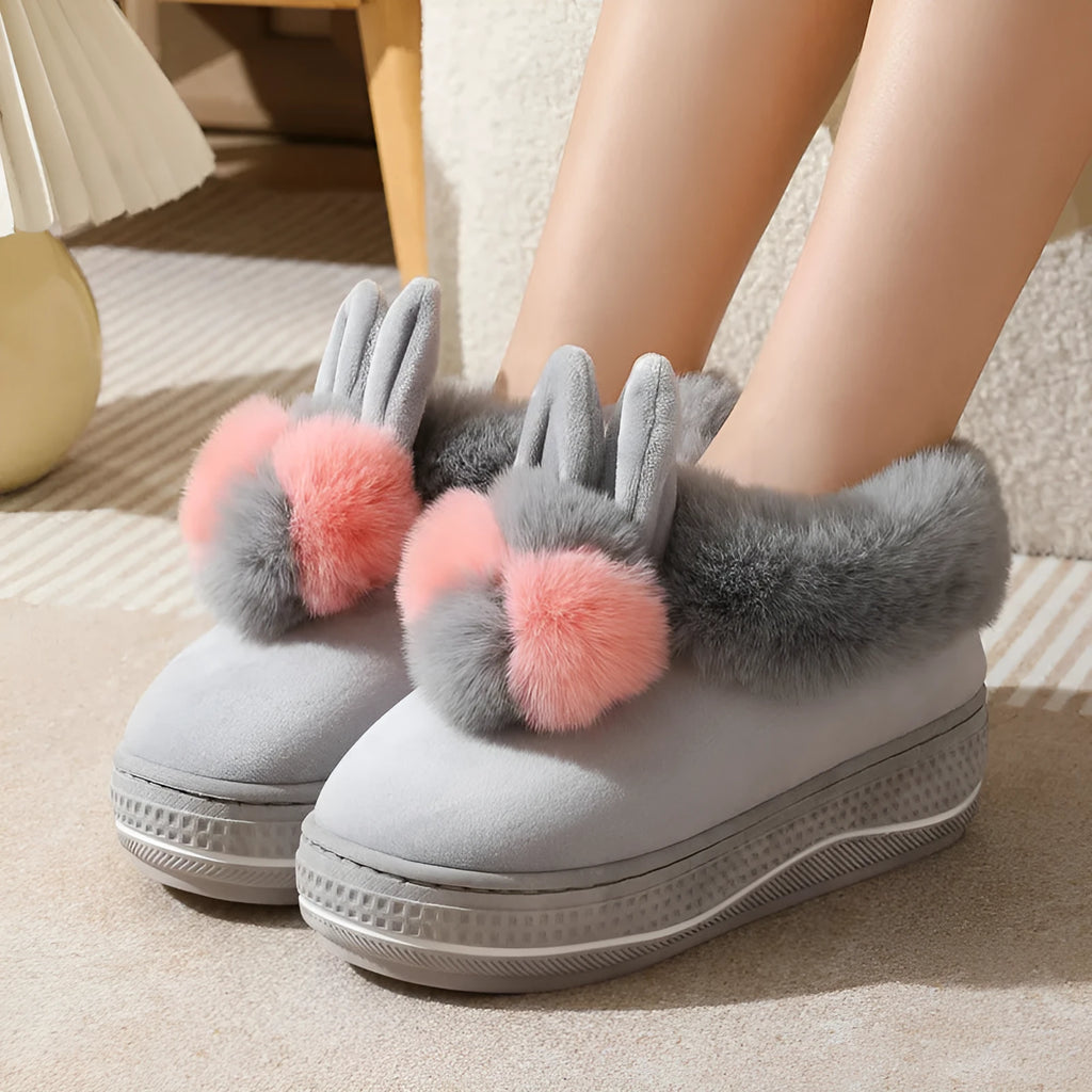 Winter high heel slippers with plush upper and thick TPR sole in gray colour on a floor