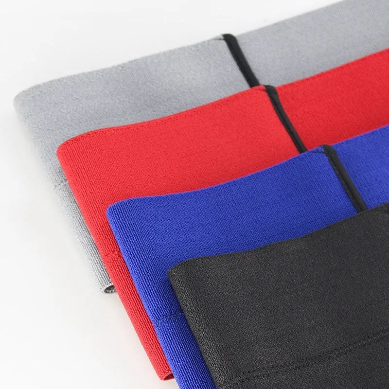 Elastic elbow support bandage for boxing in red, shown in a medium size.