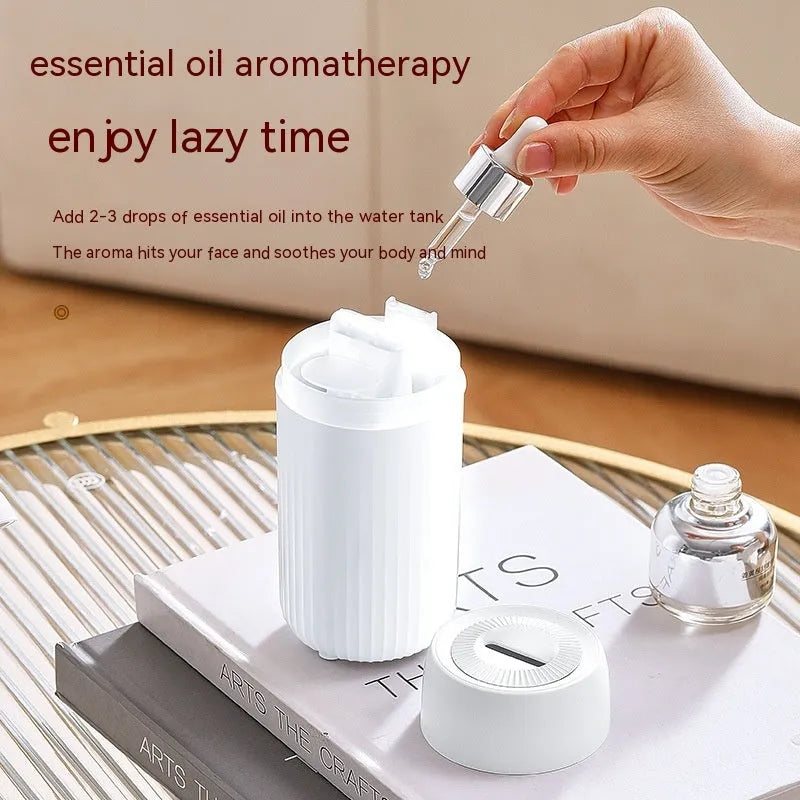 Car flame simulation aroma diffuser with automatic sprayer in black or white, showing dimensions 70×70×143mm