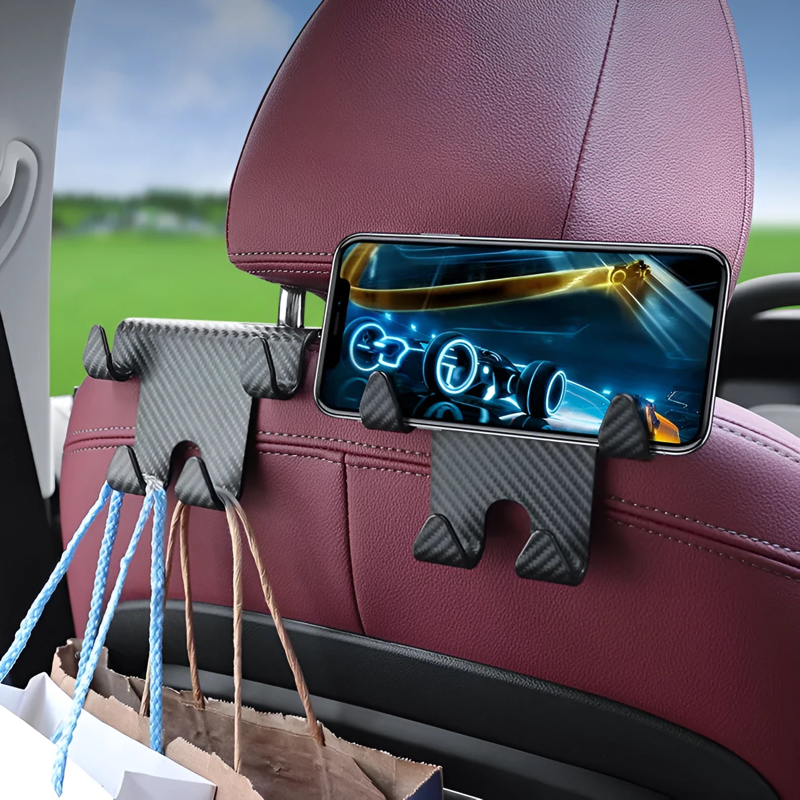 Black ABS plastic car seat back hook with integrated mobile phone holder bracket.