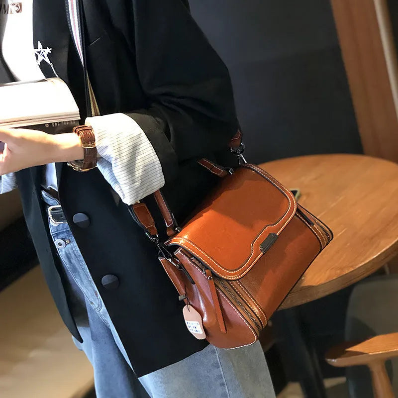 Women's genuine leather messenger bag in horizontal square shape with oil wax finish and multiple internal compartments