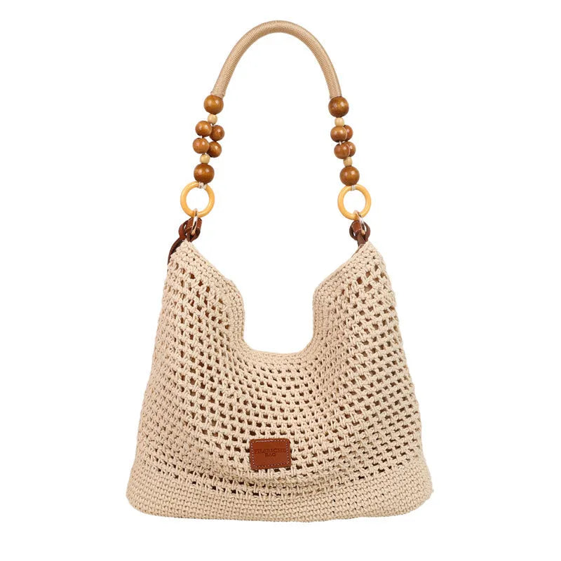 Large capacity knitted tote beach bag in brown with contrast stitching, bucket shape, crossbody strap, and zipped internal compartment