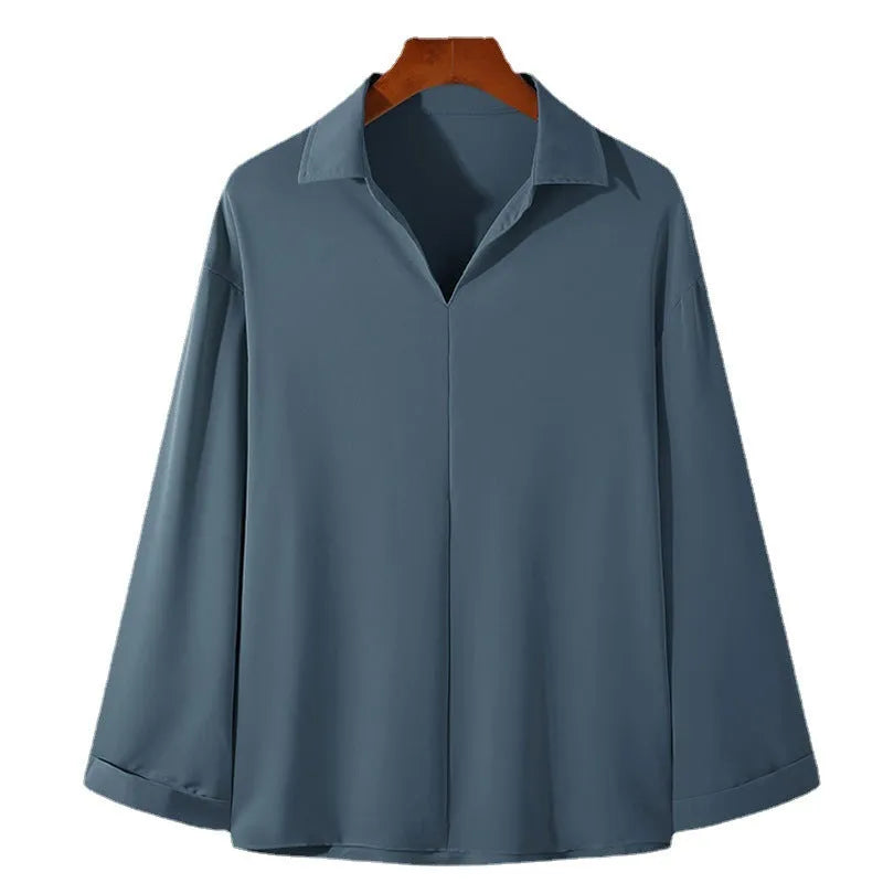 Men's loose fit long sleeve casual shirt in a solid colour, featuring a non-iron lightweight polyester blend fabric.
