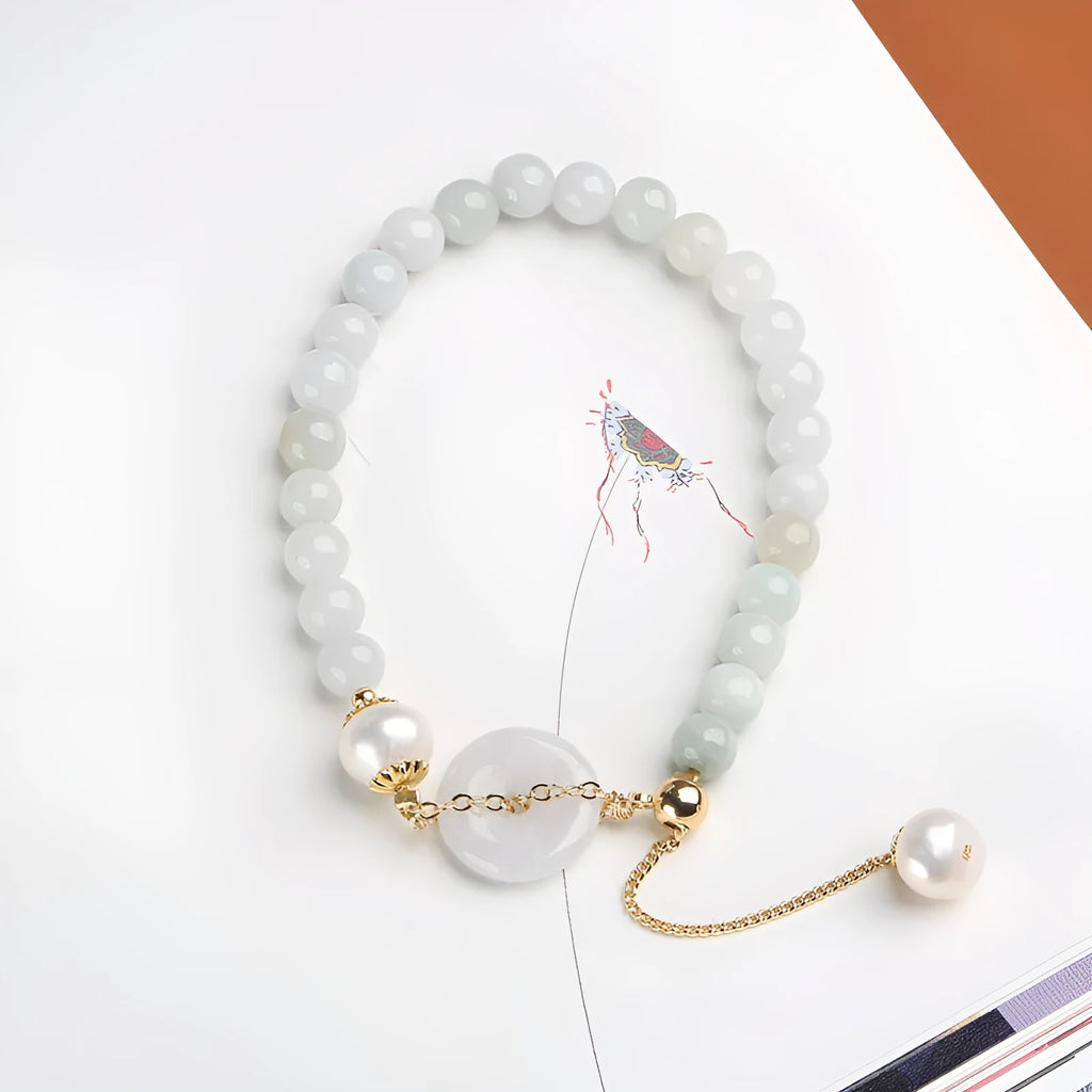 Women's jade bracelet with emerald peace buckle and pearl details in geometric national style design