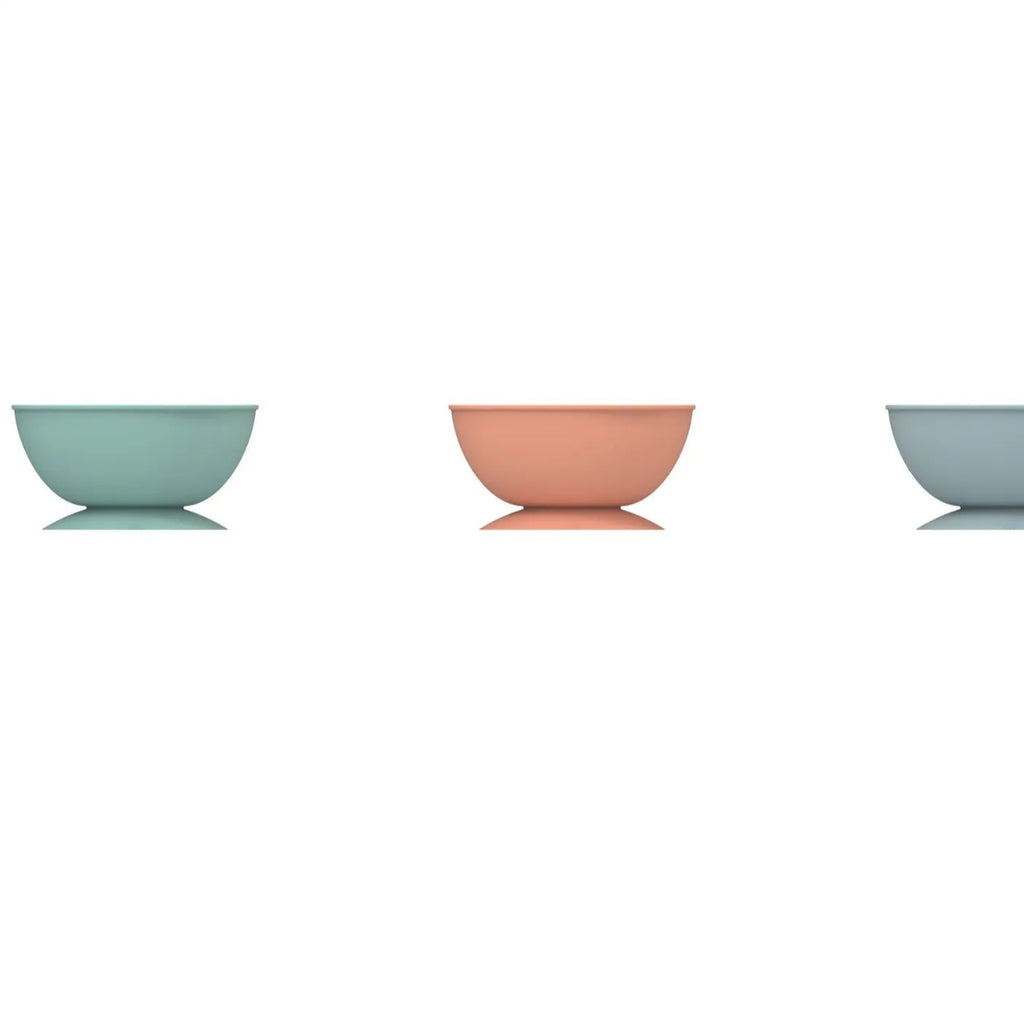 Cyan silicone slow feeder dog bowl with textured surface and suction cup base showing 15.8cm diameter