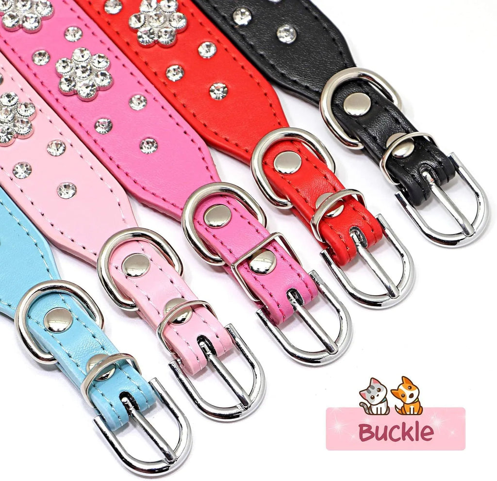 Close-up of a black PU leather dog collar with a studded rhinestone flower pattern and a metal D-ring.