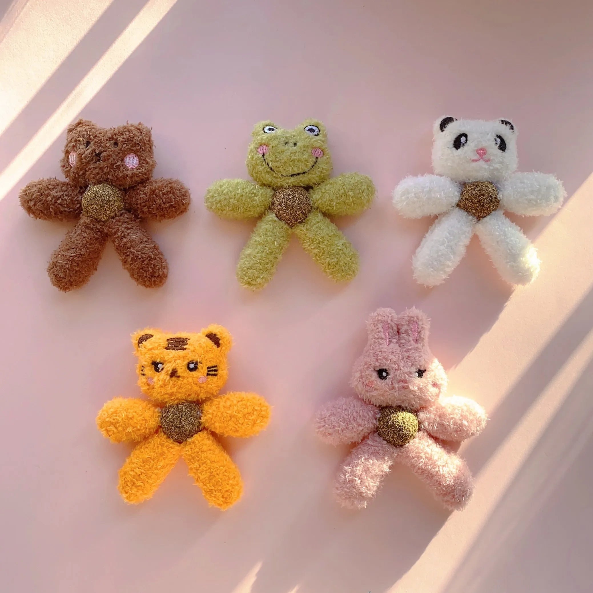 Soft stuffed catnip chewing ball toy for indoor cats, shown in animal designs like panda and bunny.