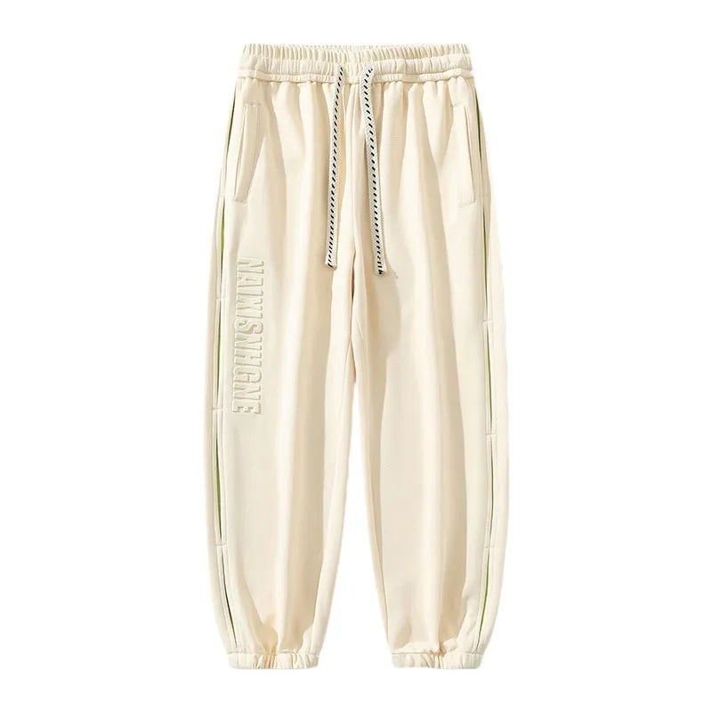 Men's cotton ankle banded pants with collage stitching printing in loose fit design