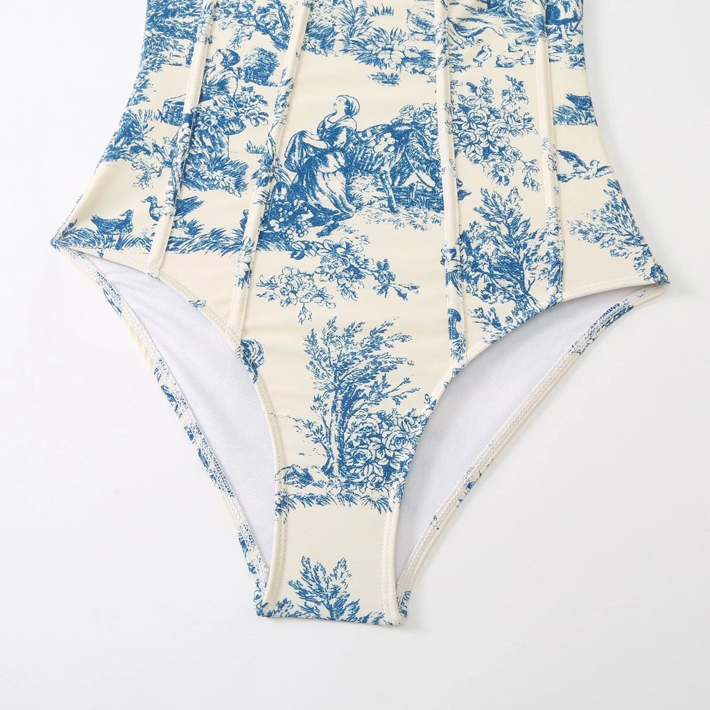 Blue patterned one-piece swimsuit for women with a matching lightweight gauze skirt cover-up.