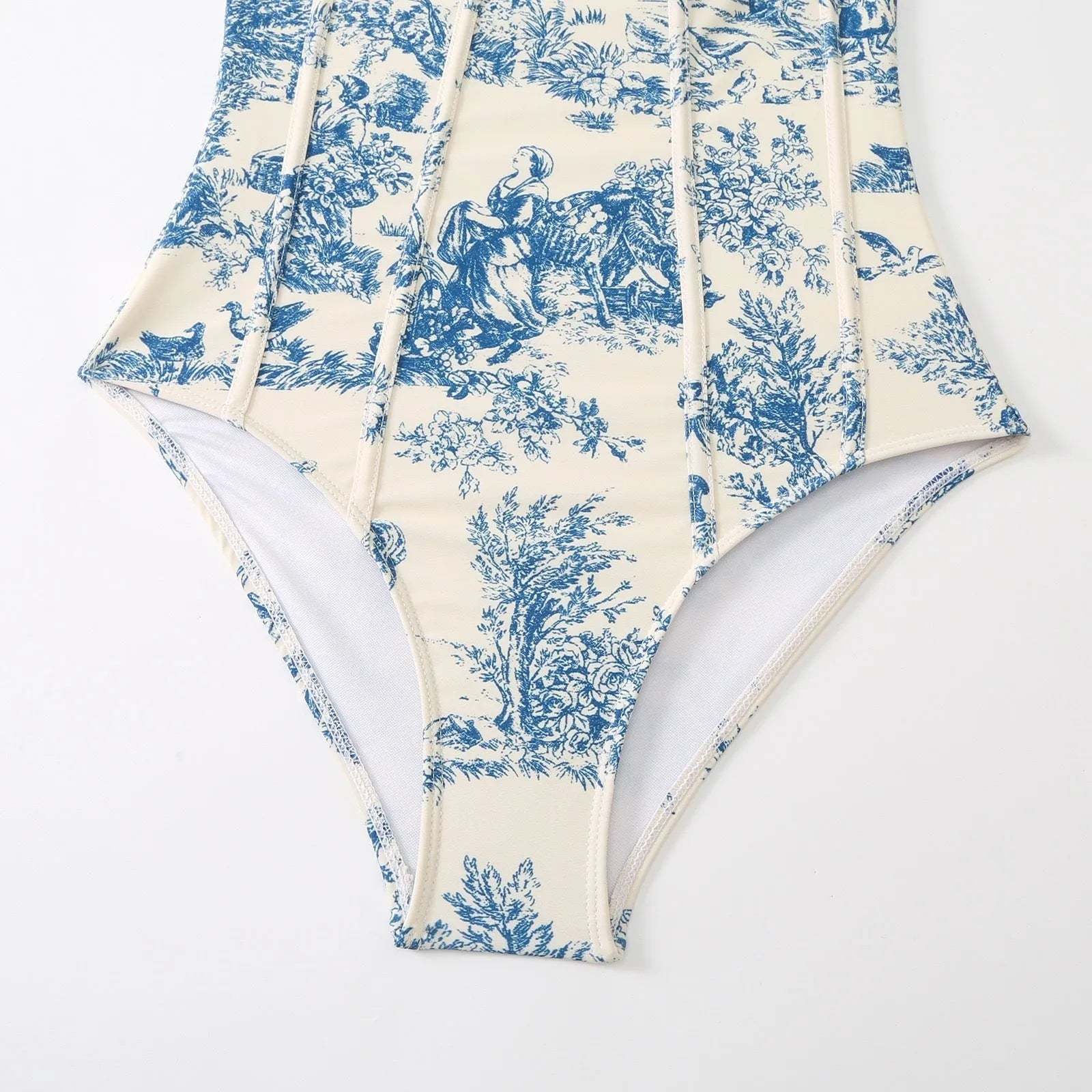 Blue patterned one-piece swimsuit for women with a matching lightweight gauze skirt cover-up.