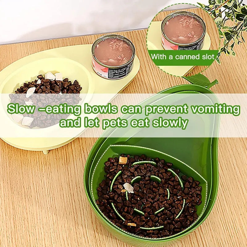Avocado-shaped automatic water pet feeder with a green water reservoir and a pink slow food bowl on a white surface