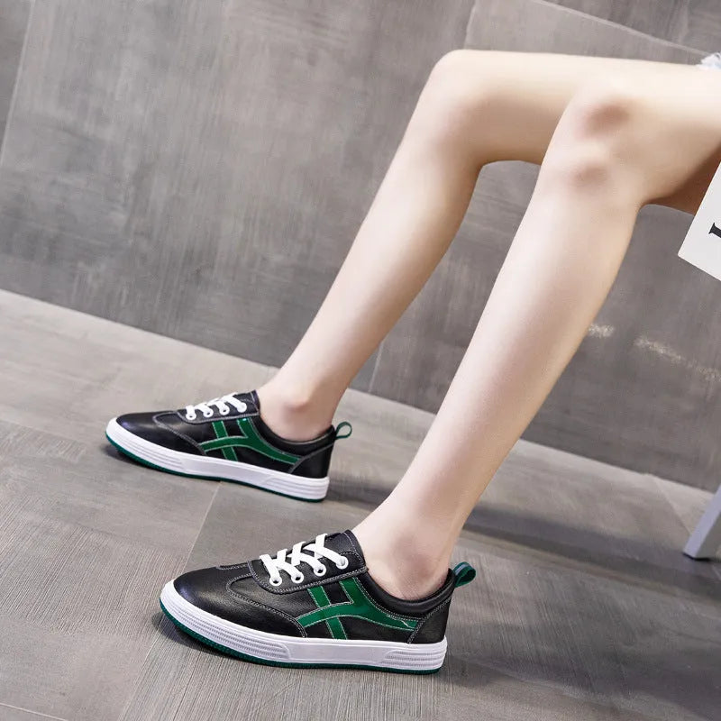 White and black casual Korean style low-top sneakers with sequin detailing, first layer cowhide upper, elastic band closure, and rubber sole