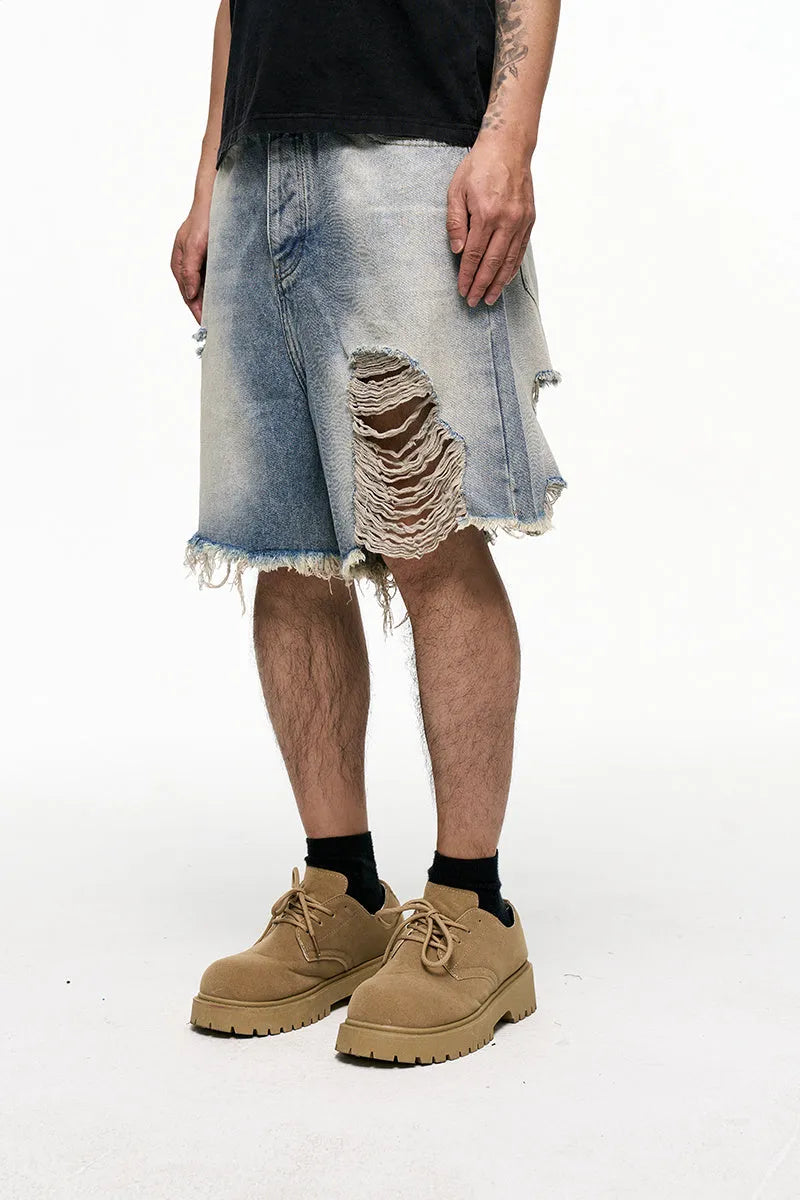 Men's light blue retro washed baggy denim shorts with wide leg cut and zipper fly