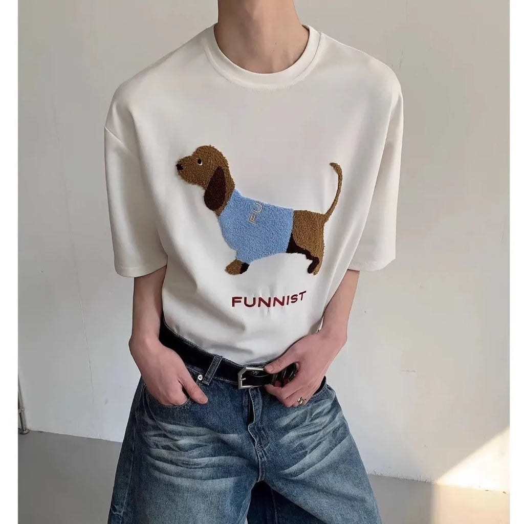 Grey men's cotton t-shirt with embroidered dachshund dog holding a towel graphic.