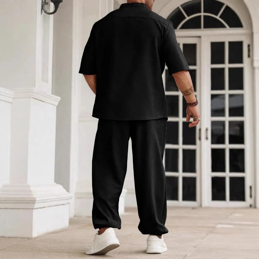 Men's casual cotton linen short-sleeved shirt and long trousers set in apricot, laid flat.