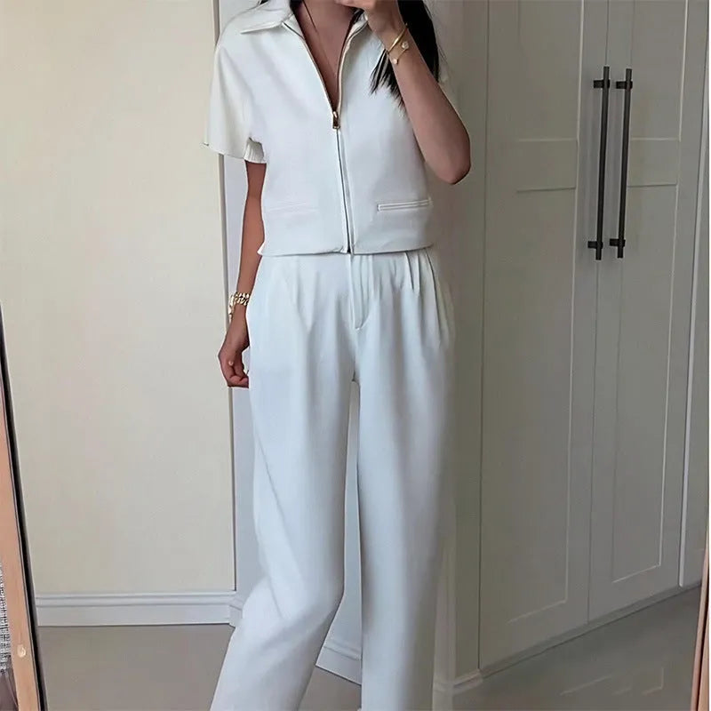 Loose fit casual polyester top in black colour with short sleeves on hanger