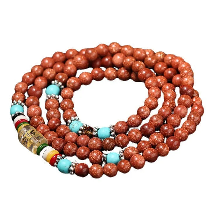 Golden star stone and nugget sand multi-circle bracelet with fu character on a retro-style chain.