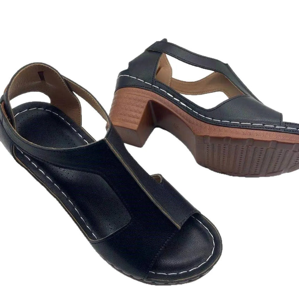 Women's beige peep toe wedge sandals with Roman ankle straps and a buckle closure on a low heel.