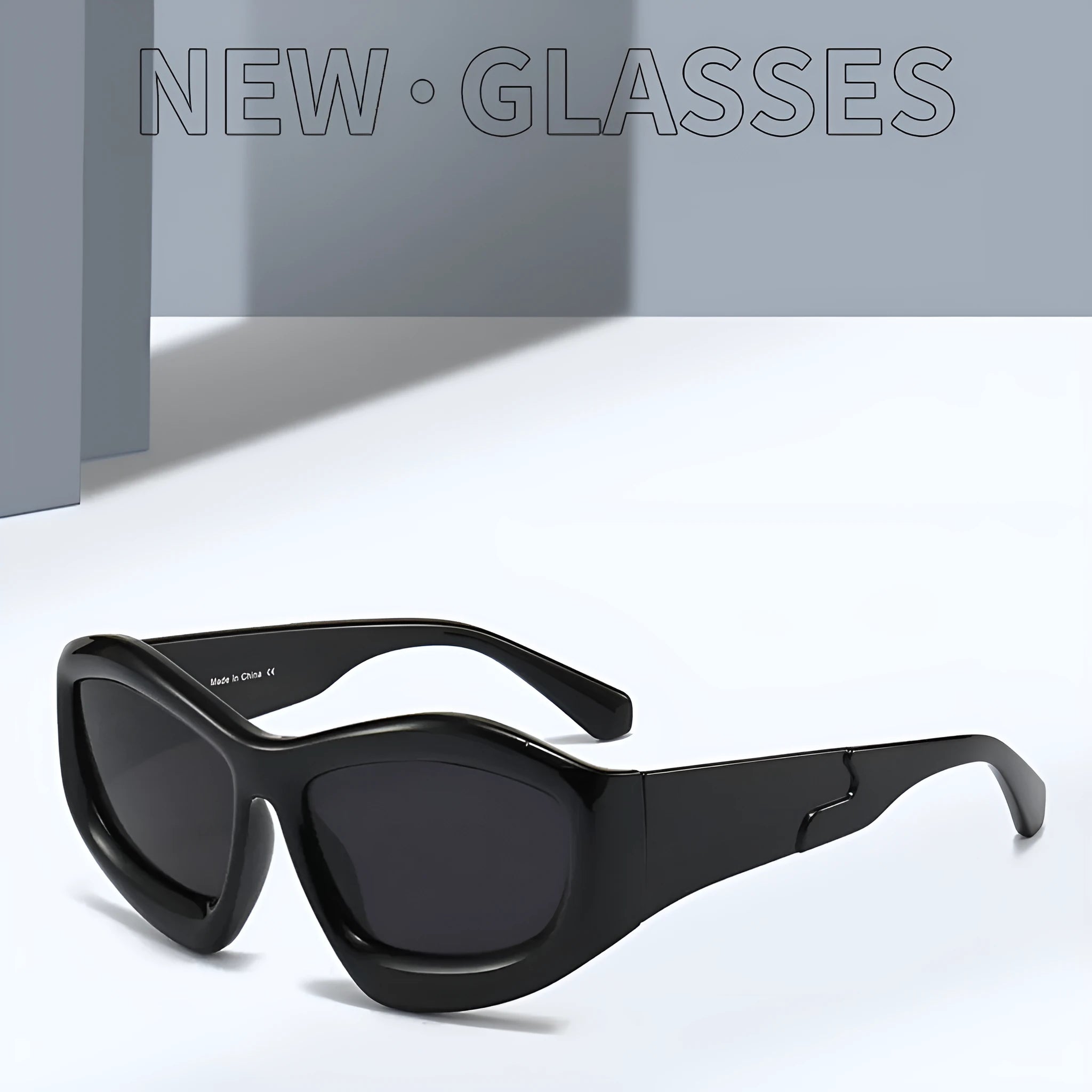 Unisex concave shape sunglasses with bubble design in black frame and black grey lens for outdoor sun protection