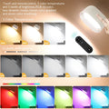 White remote touch magnetic wall lamp with oval light on a wall, showing remote control.