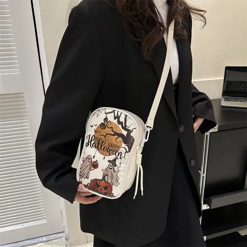 Halloween graffiti crossbody phone bag with pumpkin ghost bat prints in multiple colours