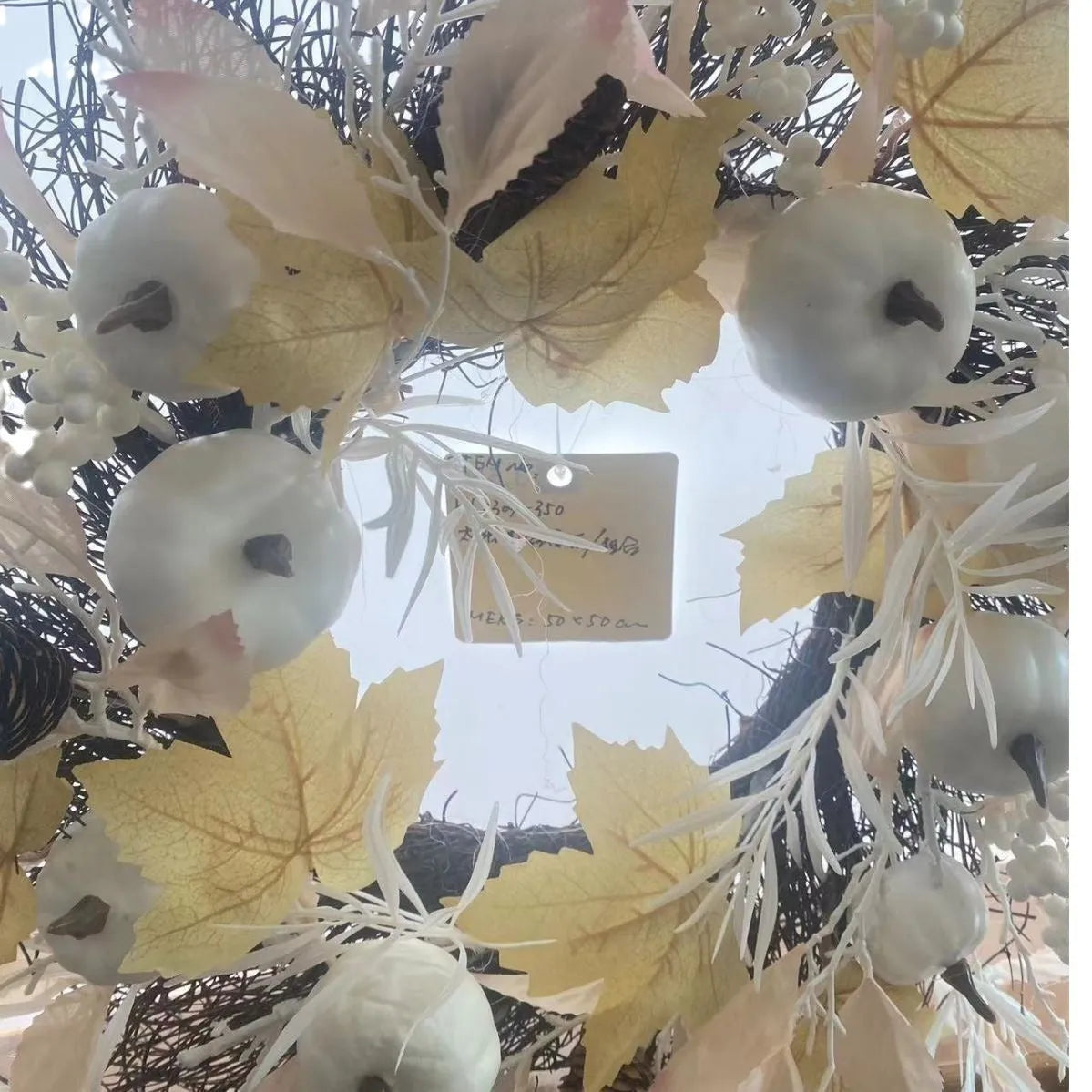 50cm artificial autumn Halloween wreath with pumpkins on white background