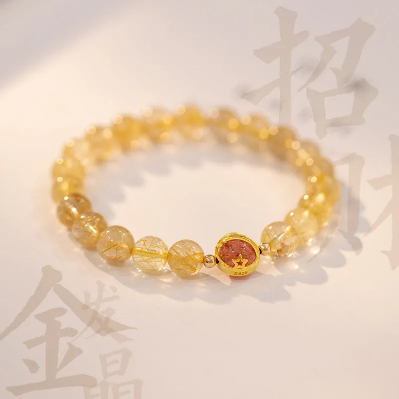 Natural citrine gold rutilated quartz diamond cut bracelet 6mm beads on neutral background