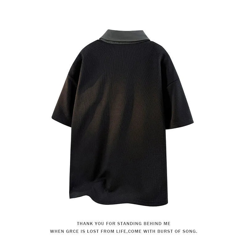 Men's black heavy Henry collar short sleeve polo shirt sweater with padding on a hanger.