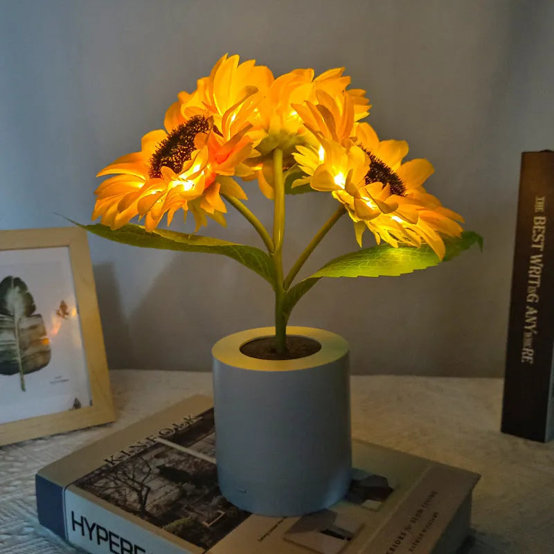 Rechargeable sunflower LED simulation night light with warm glow on a table