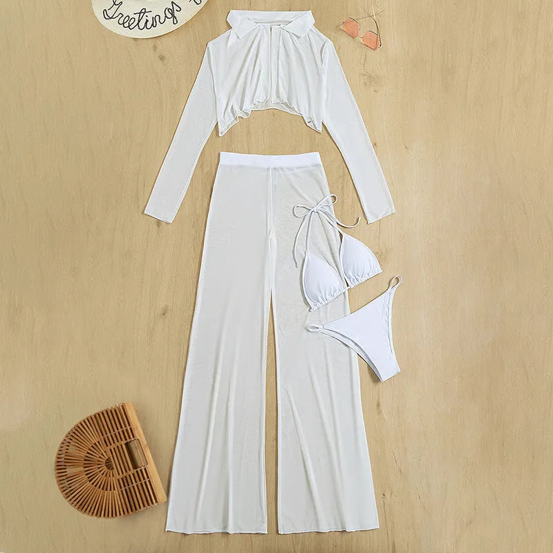Women's white four-piece swimsuit set with high waist bottoms and backless top on a beach background